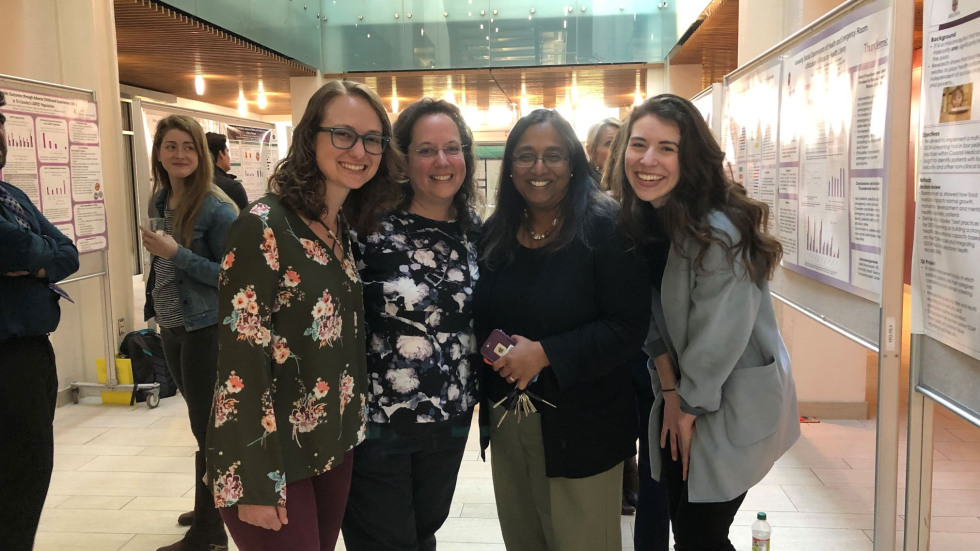 Gowri and Karyn posing with students